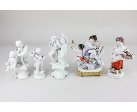 A Rudolstadt Volkstedt porcelain figure group of three putti playing instruments, on integral swagged gilt base, 19cm high, a