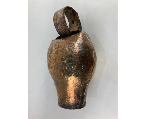 A large copper bull / cow bell with bent horn ring 40cm