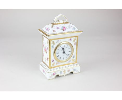 A Royal Crown Derby 'Royal Antoinette' porcelain mantle clock, with floral decoration and gilt embellishments, on white groun