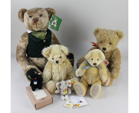 A Steiff Club 2000 black mohair miniature teddy bear, with ear button and maker's tags, 7cm high, boxed with paperwork, and a