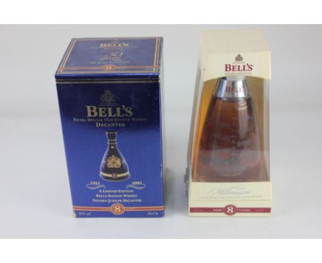 A Bell's limited edition Golden Jubilee scotch whiskey in Wade blue ceramic decanter aged 8 years and a Bell's 2000 Millenniu