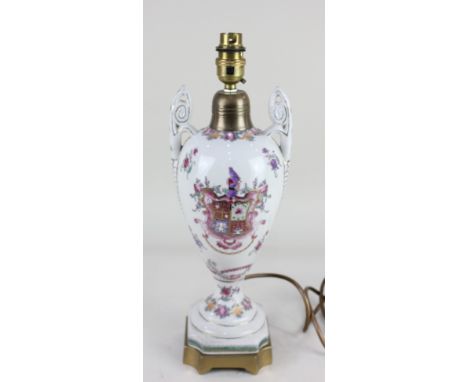 A brass mounted armorial porcelain table lamp, with two scroll handles, 39.5cm high