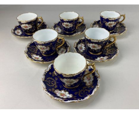 A set of six Coalport porcelain coffee cups and saucers, with floral and gilt design on blue ground (a/f)