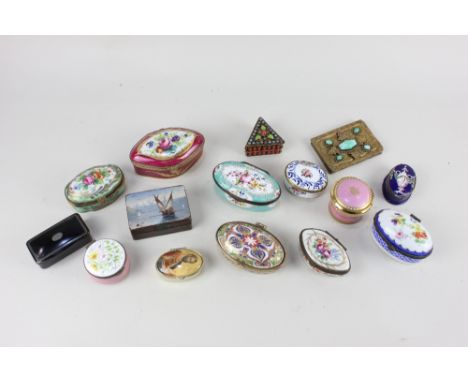 A collection of 19th century and later porcelain and enamel pill and trinket boxes, together with a gilt metal cigarette case