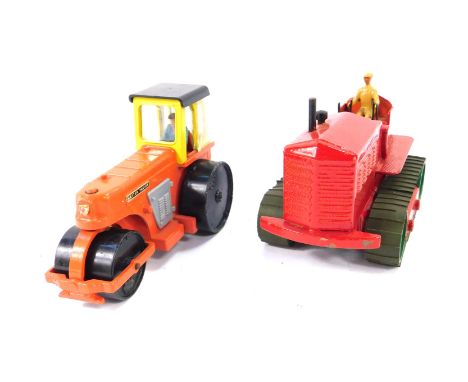 A Dinky Supertoys heavy tractor, red with a driver, No 563, together with an Aveling - Barford diesel roller, orange with yel