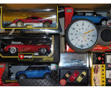 Burago Vanguards Chad Valley and other die cast vehicles, including Mini Coopers, a Burago Jaguar E Cabriolet 1961, scale 1:1