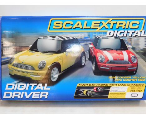 A Scalextric Digital Driver Set, Mini Cooper yellow and red, with multi car racing and lane changing, boxed.