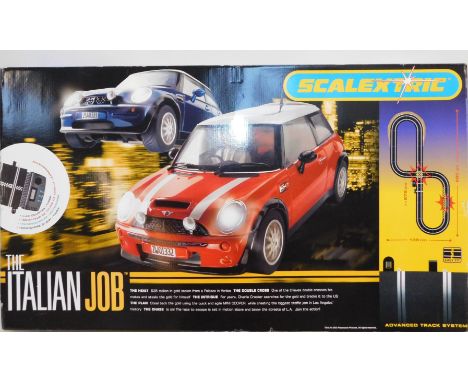 A Scalextric The Italian Job Sports Set, with two Mini Coopers and advanced track sytem, boxed.