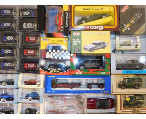 Corgi Lledo and other die cast vintage cars, sports cars and trucks, various scales, together with Mini Cooper key rings, Sca