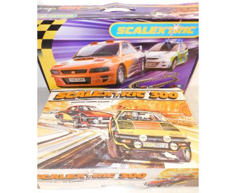 A Scalextric 300 electric model racing set, together with a Hot Pursuit X2 set, with Advance Track System, both boxed. (2)
