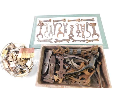 Motorcycle and automobile spanners, for BSA, Regent, Austin, framed, together with hand tools.