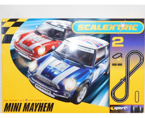 A Scalextric Mini Mayhem Set 2, with Mini Cooper numbers 1 and 2, advanced track system, boxed.