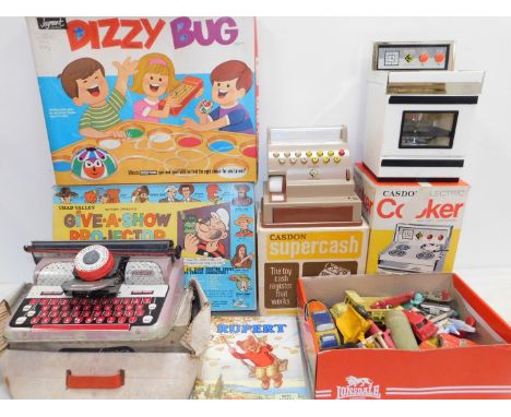 A Caston Electric Battery Operated Cooker, a Super cash till, Mettoy Elegant Typewriter, tin plate toys, Dizzy Bug, Rupert Be