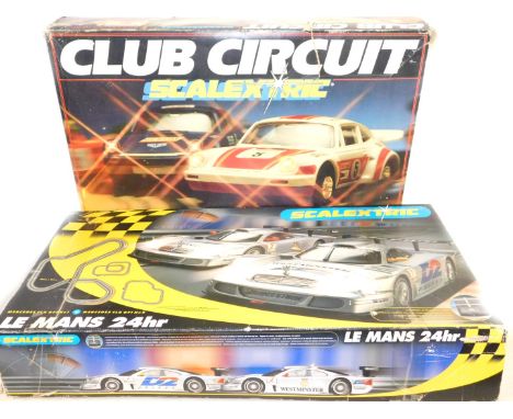 A Scalextric Le Mans 24hr Racing set, together with a club circuit set with magnatraction and break lights, both boxed. (2)