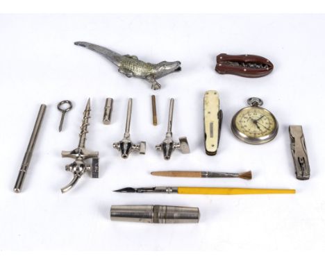 A collection of assorted items including, nut cracker, penknives, wine taps, stop watch and other items