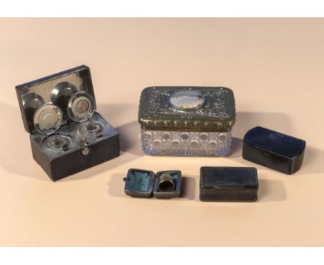 A travelling inkwell, thimble, two bone snuff boxes and a lidded glass box