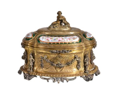 A French gilt metal and enamelled casket by Tahan of Paris, circa 1870, of oval section, the domed cover surmounted by a silv