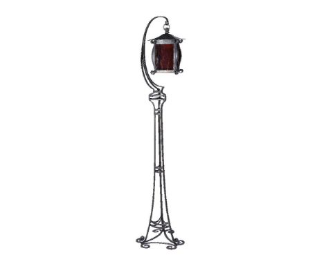 An Art Deco wrought iron standard for a hanging lamp, probably French, 1930s, with an associated sheet iron and coloured glas