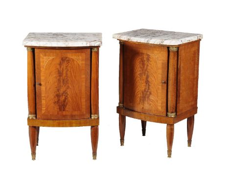 A pair of French mahogany and marble topped bedside cupboards, first half 20th century, 26cm high, 53cm wide, 40cm deep