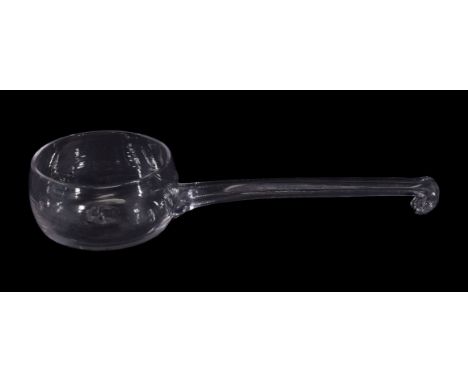 A glass punch ladle, 18th or early 19th century, 22cm long Provenance: The A. Leonard Fuller collection.