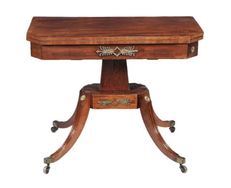 A Regency mahogany card table, circa 1815, the canted top opening to baize playing surface and swivelling to reveal the compa