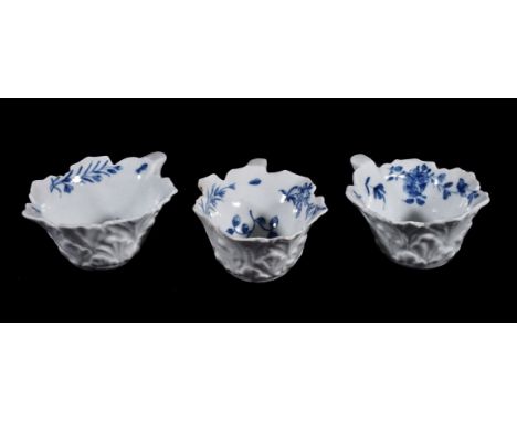 Three similar Worcester blue and white butter-boats, circa 1765, of typical leaf-shaped form with 'geranium-leaf' moulded ext