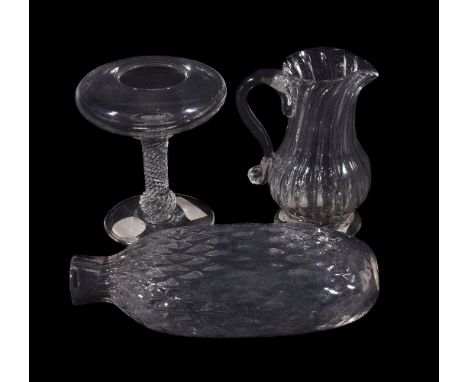 A glass oil lamp, mid 18th century,  with spirally fluted stem with basal knop and conical foot, 8.5cm high; a fluted baluste