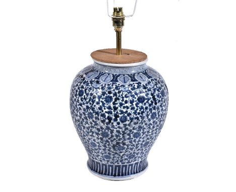 A Chinese blue and white vase, 20th century, painted with scrolling foliage, 31cm high, adapted as a lamp; and a Chinese Fami