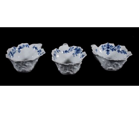 Three similar Worcester blue and white butter-boats, circa 1765, of typical leaf-shaped form with 'geranium-leaf' moulded ext
