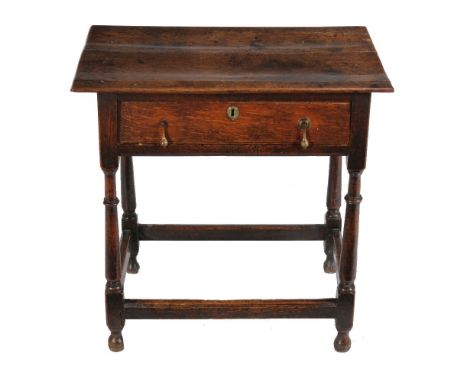 An oak side table, first quarter 18th century, 70cm high, 70cm wide, 46cm deep   Provenance: from a Cheyne Walk property