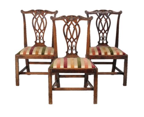 A set of three George III mahogany side chairs, circa 1770, in the manner of Thomas Chippendale Provenance: Kingstone Lisle P