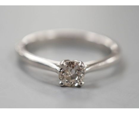 A modern platinum and solitaire diamond ring, size Q/R, gross weight 5.4 grams,stone diameter 4.8mm.