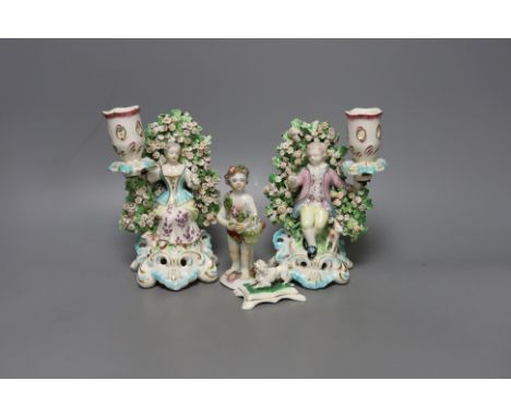 A pair of Derby bocage candlestick figures, c.1775, 17cm tall, a Bow cherub figure, c.1760 and a Staffordshire poodle (4)