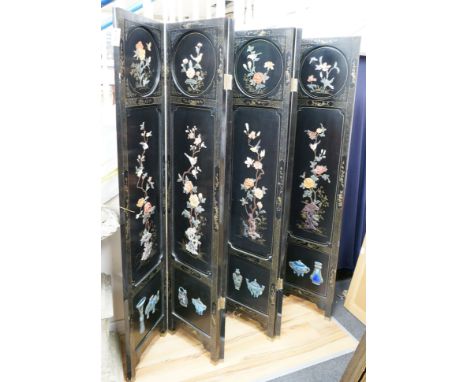 A Chinese ebonised hardstone and enamel mounted six fold dressing screen, each panel width 40cm, height 183cm