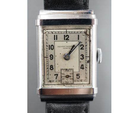 A gentleman's steel Record Watch Co, manual wind wrist watch, on associated leather strap.