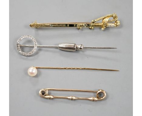 A French white metal (poincon mark for platinum) and diamond set tie pin, 64mm, gross 3.4 grams, a 15ct and enamel(a.f.) swor