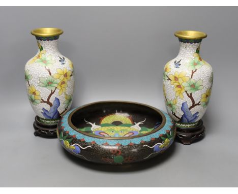 A pair of Chinese cloisonné enamel vases, 25cm tall including stands, together with a Chinese cloisonné enamel dragon bowl (3
