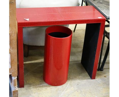 A contemporary red faux crocodile console table, width 80cm, depth 32cm, height 70cm and a stick stand