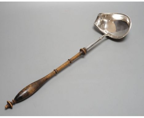 A Swedish? white metal punch ladle, with turned wooden handle, 42.5cm.