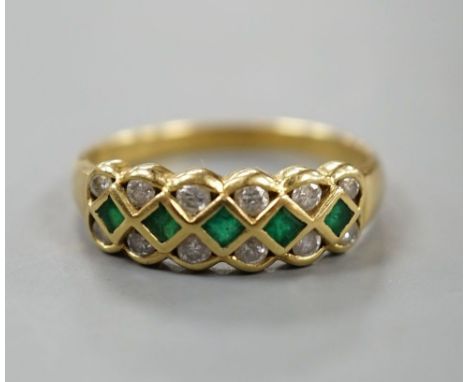 A modern 18ct gold, emerald and diamond line cluster set half hoop ring, size R, gross 3.9 grams.