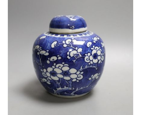 A Chinese blue and white jar and cover, Kangxi mark and of the period, 15cm tall