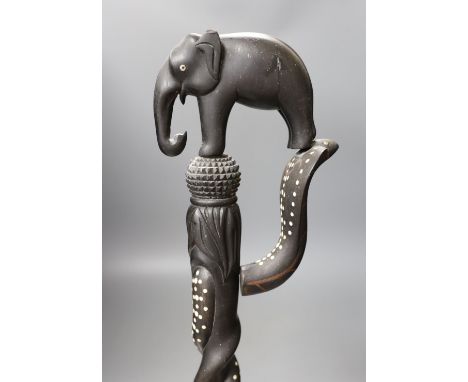 A late 19th/early 20th century Ceylonese carved ebony ‘elephant’ walking stick, 90cm