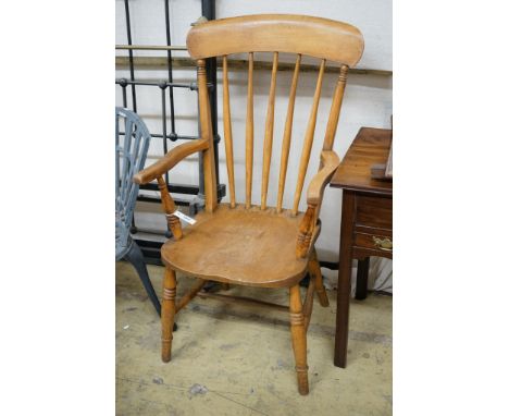 A pair of late Victorian elm and beech Windsor comb back armchairs, width 56cm, depth 47cm, height 112cm