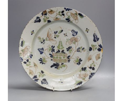 An English polychrome delftware charger,33cms diameter.