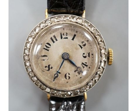 A lady's early 20th century 18k and diamond set manual wind  wrist watch, on later leather strap,gross weight 16.1 grams.