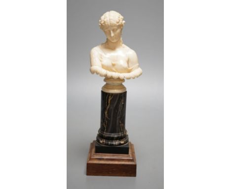 A 19th-century Dieppe ivory bust of Clytie, on a marble and rosewood pedestal, after the model in the British Museum - 24.5cm