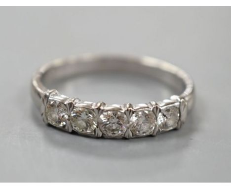 An 18ct white metal and five stone diamond set half hoop ring, size R, gross weight 3.4 grams.