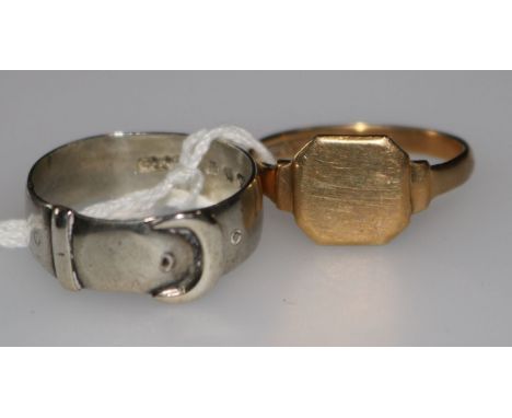 A 9ct gold signet ring and a silver buckle ring.