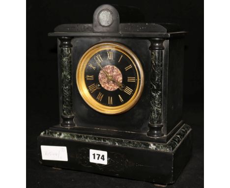 A black marble mantel clock