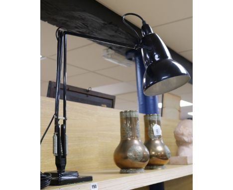 A black Anglepoise lamp